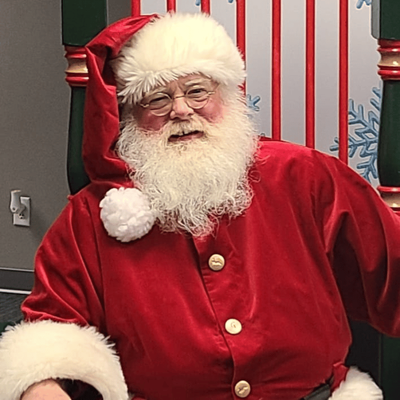 Santa Dave by fireplace